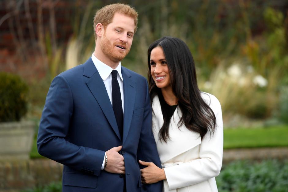 Britain’s Prince Harry poses with Meghan Markle in the Sunken Garden of Kensington Palace, London