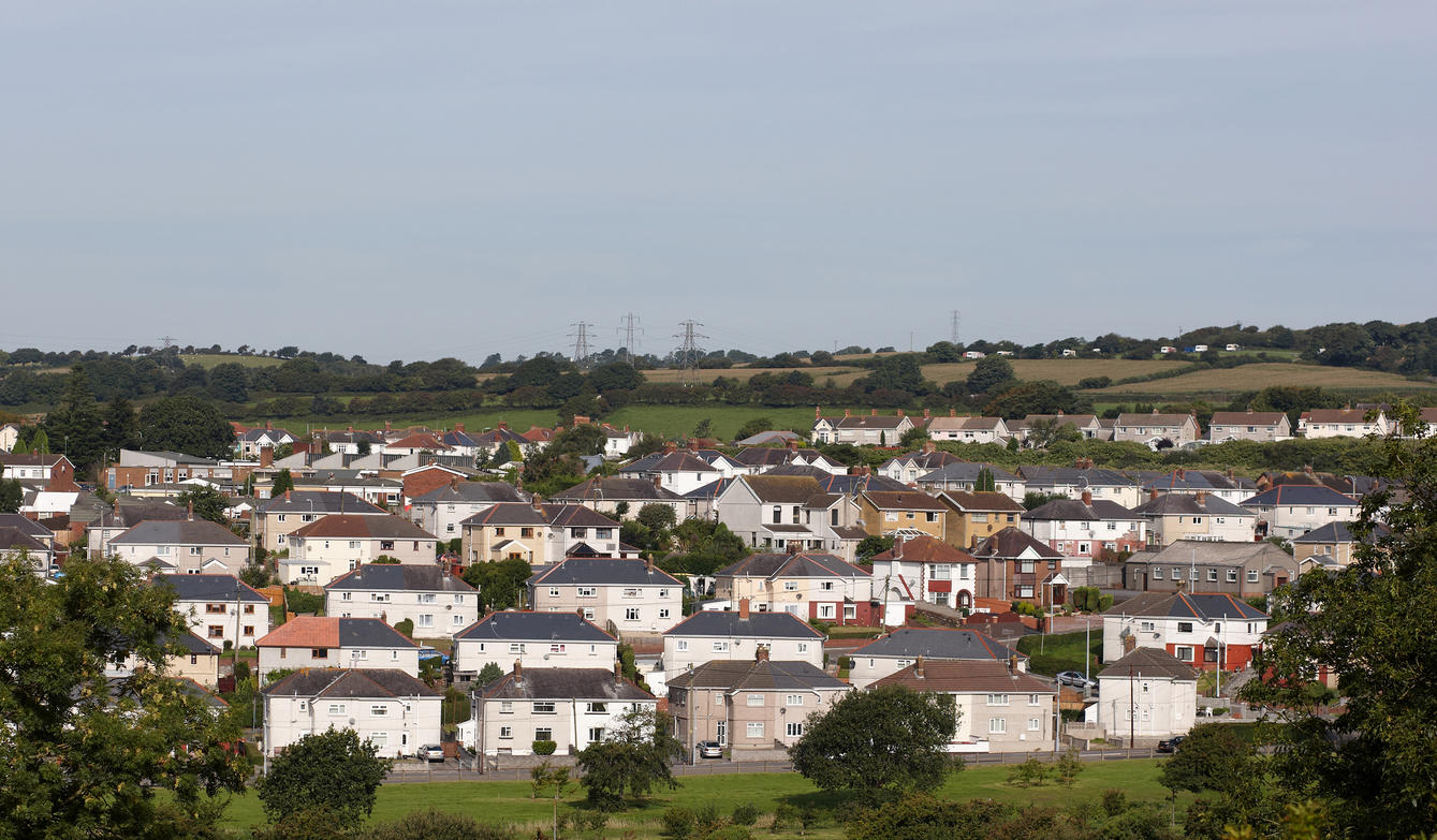 Morning sunlight on welsh town municipal housing