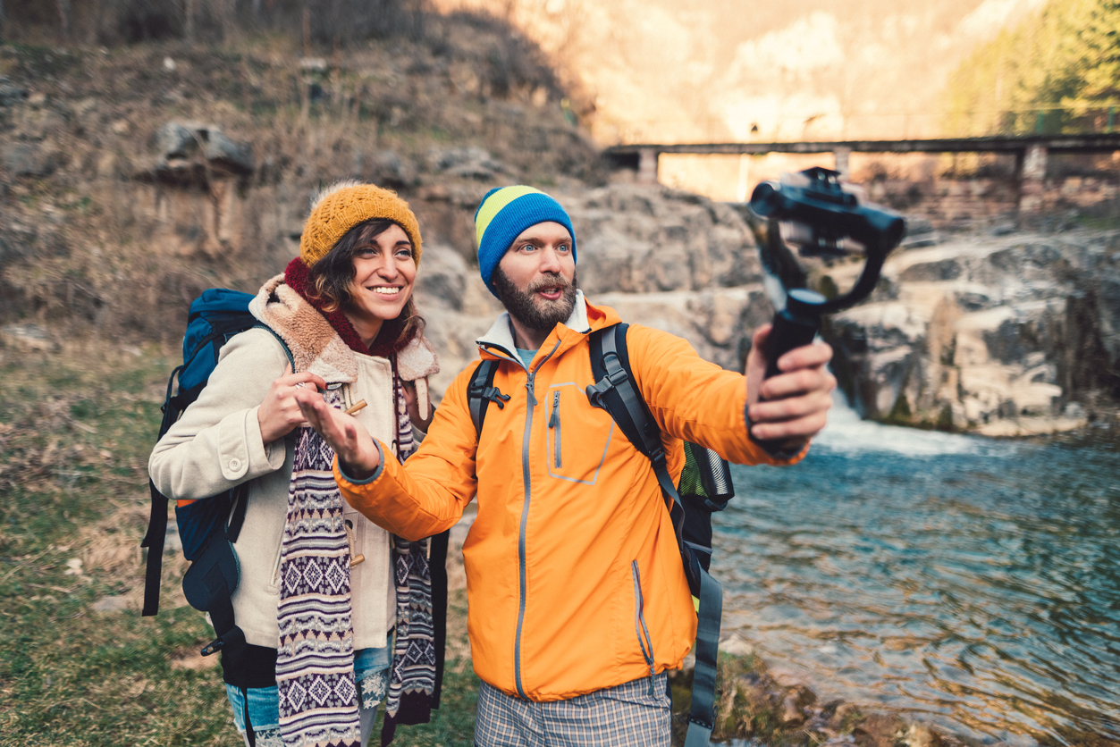 Couple hiking, vlogging and having fun